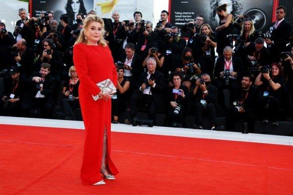 The lady in red: Tessa Thompson and Catherine Deneuve walk the red carpet with dignity