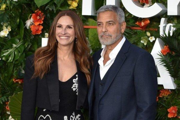 Julia Roberts joined George in a graffiti dress Clooney at the premiere of 