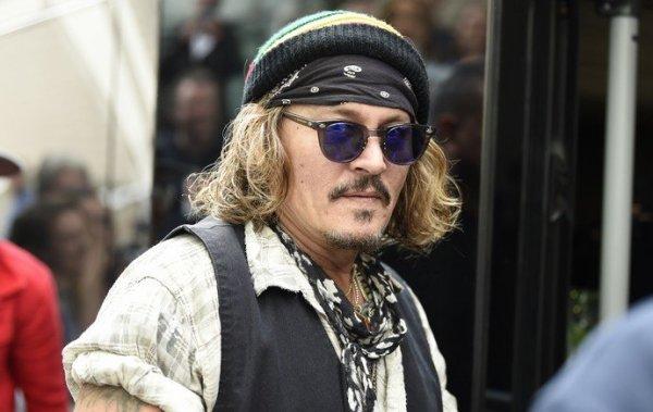 Johnny Depp hovered over the stage as Moon Man