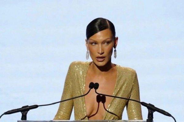 Bella Hadid in a gold dress behind half a million received the 