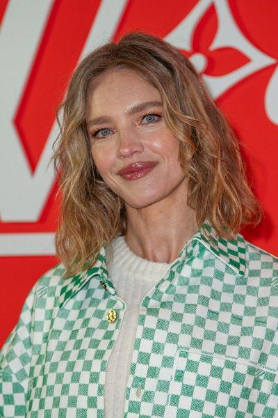 Natalia Vodianova in attended the Louis Vuitton show in Paris in an elegant and bright outfit