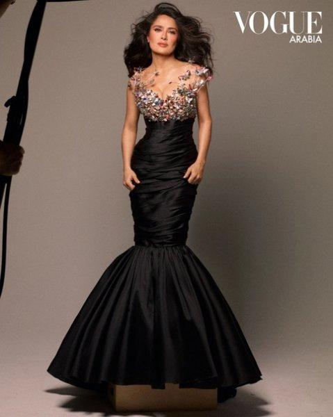 57-year-old Salma Hayek appeared on the cover of the gloss in a dress with a deep neckline